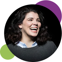 A photo of author, speaker & journalist Celeste Headlee. She is laughing.